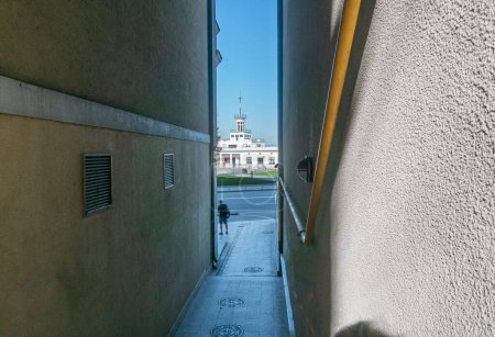 Photo for View through the narrow arch of the house to the historical building of the river station on Poshtova Square in Kyiv - Royalty Free Image