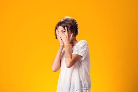 Photo for Sad kid girl over yellow background. Frustration concept - Royalty Free Image