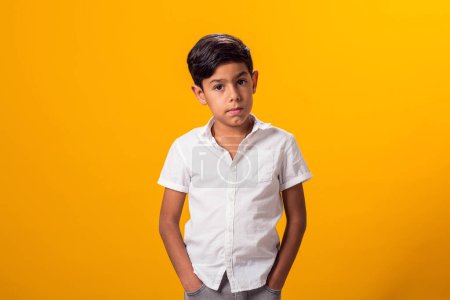 Photo for Portrait of upset kid boy over yellow background. Emotions and bulling concept - Royalty Free Image