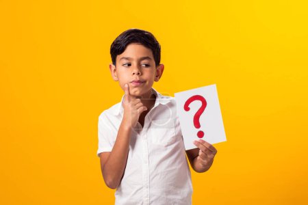 Photo for Portrait of kid boy holding question mark card in hand. Education concept - Royalty Free Image