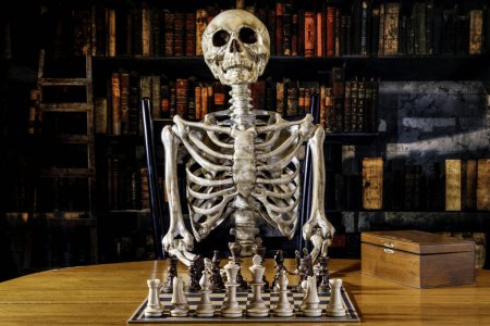 Photo for Skeleton sitting at table waiting to play chess with wood chess set and retro looking library background - Royalty Free Image