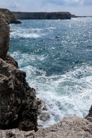 Photo for High limestone coastal cliffs against the backdrop of the Black Sea on Tarkhankut, Atlesh, western Crimea - Royalty Free Image