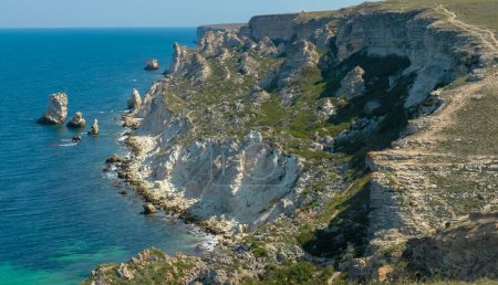 Photo for View of the steep banks and rocks in the water in the Dzhangul tract, western Crimea - Royalty Free Image