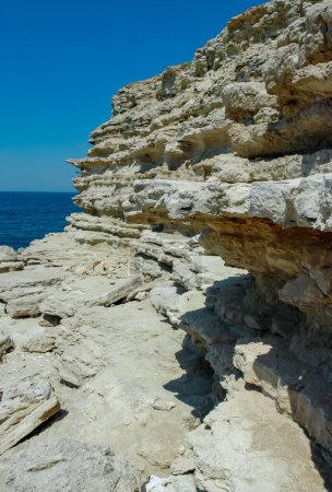 Photo for Steep karst limestone shores and rocks in the Dzhangul tract, western Crimea, Tarkhankut - Royalty Free Image