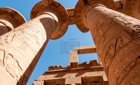 Photo for EGYPT,  LUXOR - MARCH 01, 2019: ancient temple columns with hieroglyphs, drawings and inscriptions at Karnak in Luxor, Egypt - Royalty Free Image