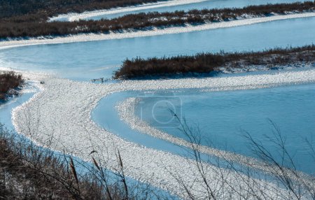 Photo for Frozen water, patterns of snow in small lakes. Tiligul estuary, Ukraine - Royalty Free Image