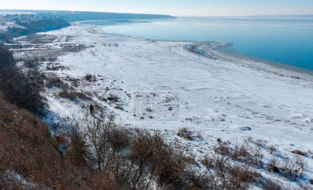 Photo for Winter landscape, Snow-covered shores and frozen Tiligul estuary, Ukraine - Royalty Free Image