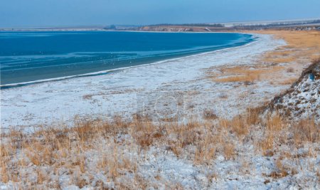 Photo for Winter landscape, Snow-covered shores and frozen Tiligul estuary, Ukraine - Royalty Free Image