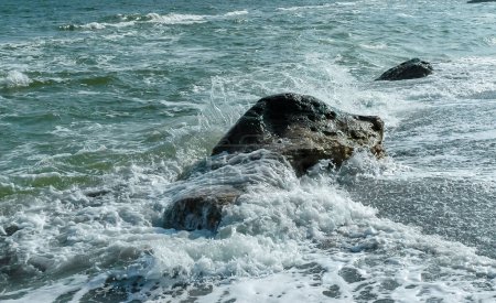 Photo for Sea waves crashing against rocks on a sand and stone beach, Odessa - Royalty Free Image