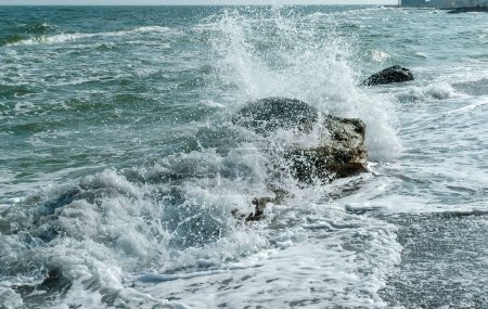 Photo for Sea waves crashing against rocks on a sand and stone beach, Odessa - Royalty Free Image