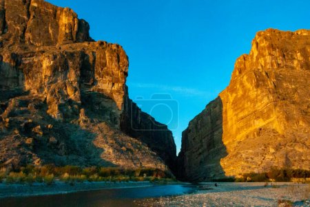 A view of Santa Elena Canyon in Big Bend National Park. Cliffs rise steeply from Rio Grande River