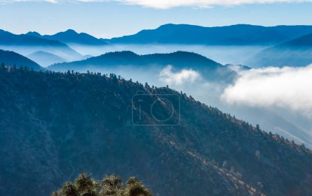 Beautiful mountain scenery on the background of clouds, layers of mountains on the horizon, Sierra Nevada Mountains, California, USA