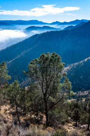 Beautiful mountain scenery on the background of clouds, layers of mountains on the horizon, Sierra Nevada Mountains, California, USA