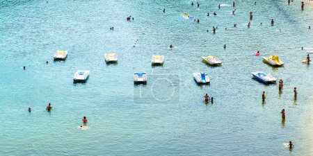 Photo for ISOLA D'ELBA, ITALY - August 24, 2018: day view of sea and bathers in famous Fetovaia beach in Elba island, Tuscany, Italy. - Royalty Free Image