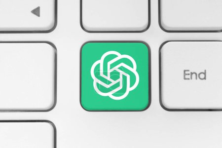Photo for OpenAI ChatGPT icon key on a white computer keyboard close-up. Concept of using the artificial intelligent services in business and modern technologies. ChatGPT is an AI chatbot developed by OpenAI - Royalty Free Image
