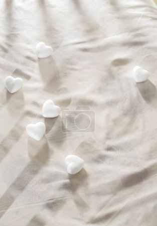 Photo for White heart shapes on the bed - Royalty Free Image