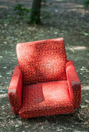 Photo for Old ragged red sofa outside - Royalty Free Image