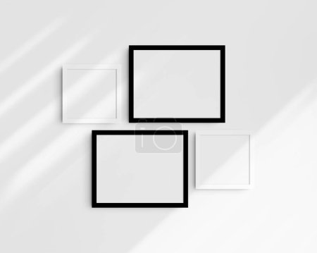 Foto de Conjunto de maquetas de pared Gallery, 4 marcos en blanco y negro. Maqueta de marco limpia, moderna y minimalista. Dos marcos horizontales y dos cuadrados, 14x11 (14: 11), 8x8 (1: 1) pulgadas, en una pared blanca con sombras. - Imagen libre de derechos