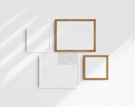 Photo for Gallery wall mockup set, 4 cherry wood and white frames. Clean, modern, and minimalist frame mockup. Two horizontal frames and two square frames, 14x11 (14:11), 8x8 (1:1) inches, on a white wall with shadows. - Royalty Free Image