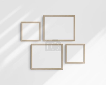 Photo for Gallery wall mockup set, 4 birch wooden frames. Clean, modern, and minimalist frame mockup. Two horizontal frames and two square frames, 14x11 (14:11), 8x8 (1:1) inches, on a white wall with shadows. - Royalty Free Image