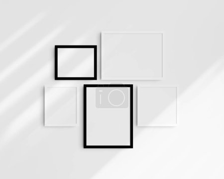 Photo for Gallery wall mockup set, 5 black and white frames. Modern, minimalist frame mockup. Two horizontal frames, two vertical frames, and a square frame, 12x16 (3:4), 16x12 (4:3), 8x10 (4:5), 10x8 (5:4), 10x10 (1:1) inches, on a white wall with shadows. - Royalty Free Image