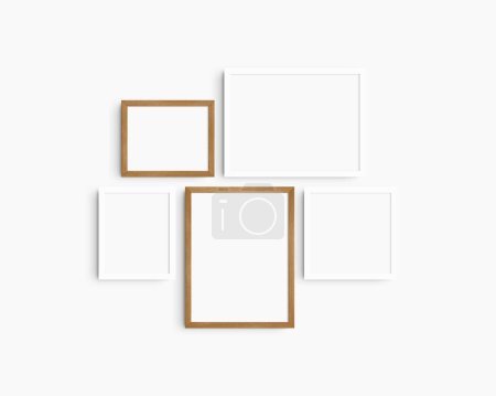 Photo for Gallery wall mockup set, 5 white and cherry wood frames. Clean, modern, minimalist frame mockup. Two horizontal frames, two vertical frames, and a square frame, 12x16 (3:4), 16x12 (4:3), 8x10 (4:5), 10x8 (5:4), 10x10 (1:1) inches, on a white wall. - Royalty Free Image