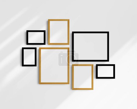 Photo for Gallery wall mockup set, 7 black and yellow oak frames. Clean, modern, and minimalist frame mockup. Three horizontal frames, and four vertical frames, 5x7 (5:7), 7x5 (7:5), 8x10 (4:5), 12x15 (4:5), 15x12 (5:4) inches, on a white wall with shadows. - Royalty Free Image