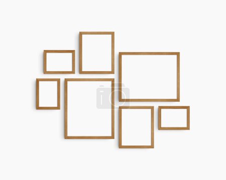 Photo for Gallery wall mockup set, 7 cherry wooden frames. Clean, modern, and minimalist frame mockup. Three horizontal frames, and four vertical frames, 5x7 (5:7), 7x5 (7:5), 8x10 (4:5), 12x15 (4:5), 15x12 (5:4) inches, on a white wall. - Royalty Free Image