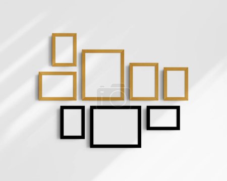Foto de Conjunto de maquetas de pared Gallery, 8 marcos de madera de roble negro y amarillo. Una maqueta moderna y minimalista. Cinco marcos verticales, y tres horizontales, 4x6 (2: 3), 6x4 (3: 2), 5x7 (5: 7), 7x5 (7: 5), 8x10 (4: 5), 10x8 (5: 4) pulgadas, en una pared blanca con sombras. - Imagen libre de derechos