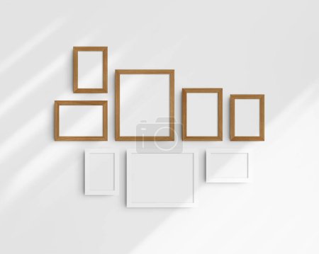 Photo for Gallery wall mockup set, 8 white and cherry wood frames. Modern, minimalist frame mockup. Five vertical frames, and three horizontal frames, 4x6 (2:3), 6x4 (3:2), 5x7 (5:7), 7x5 (7:5), 8x10 (4:5), 10x8 (5:4) inches, on a white wall with shadows. - Royalty Free Image