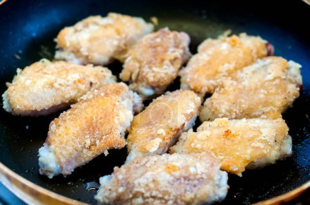 Photo for Chicken wings cooking on pan - Royalty Free Image