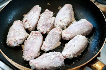 Photo for Chicken wings cooking on pan - Royalty Free Image