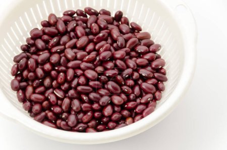 Red kidney beans in a white colander
