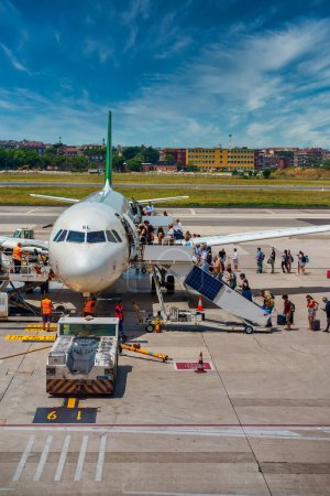 Photo for Italy, Naples - 24.10.2022: People board an Alitalia plane. - Royalty Free Image