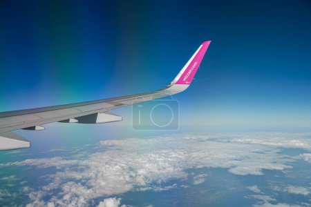 Photo for Naples, Italy - 24.06.2022: Wing of Wizz Air, view from window. - Royalty Free Image
