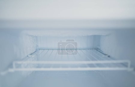Photo for Empty open freezer in the refrigerator. - Royalty Free Image