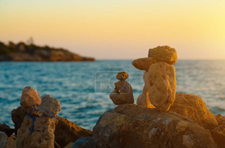 Photo for Many ZEN stones on the sunset beach. - Royalty Free Image