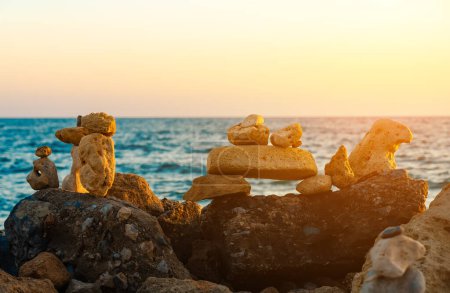Photo for Many ZEN stones on the sunset beach. - Royalty Free Image