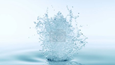 Foto de Salpicadura de agua aislada sobre fondo azul suave. Congelar el movimiento del agua explotando en el aire. - Imagen libre de derechos
