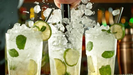 Photo for Preparation of mojito drinks on bar counter. Fresh beverages background. - Royalty Free Image