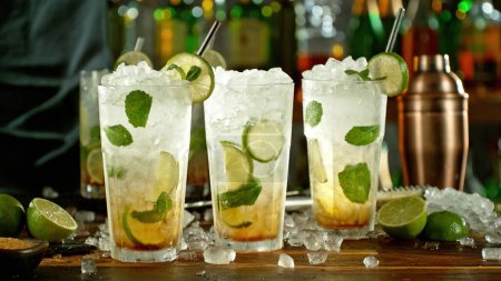 Photo for Mojito drinks on bar counter. Fresh beverages background. - Royalty Free Image
