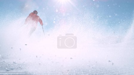 Téléchargez les photos : Free ride skier running down the hill. Powder snow is flying up in the air. - en image libre de droit