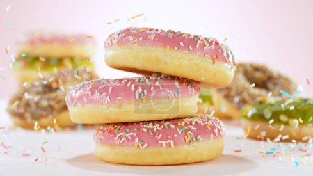 Photo for Stacking sweet colored donuts. - Royalty Free Image
