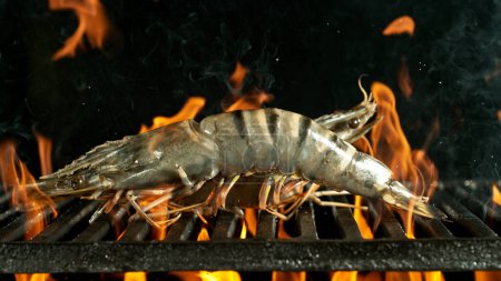 Photo for Barbecue Grill With Raw King Prawns.. Barbecue Fire Grid On Black Background. - Royalty Free Image