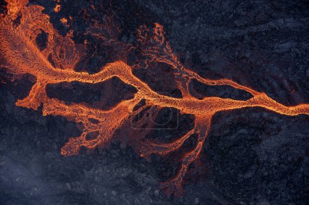Photo for Aerial view of spreading melted lava from volcano. Beautiful natural forces creating abstract background. Litli Hrutur, Fagradalsfjall, Iceland July, 2023. - Royalty Free Image