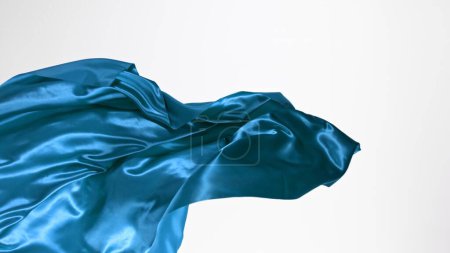 Téléchargez les photos : Élégant tissu de satin bleu lisse séparé sur fond blanc. Texture du tissu volant, mouvement de gel. - en image libre de droit