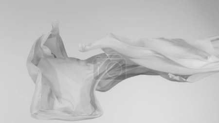 Foto de Paño transparente blanco elegante liso separado sobre fondo gris. Textura de tela voladora en movimiento de congelación. - Imagen libre de derechos