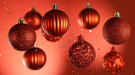 Photo for Decorative Christmas Balls Hanging with Glitters Falling Down. Abstract Celebration Background. - Royalty Free Image