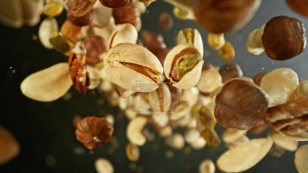 Photo for Freeze Motion of Flying Mix of Nuts. Abstract Food Background. - Royalty Free Image