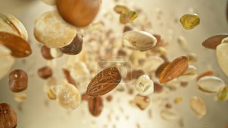 Photo for Freeze Motion of Flying Mix of Nuts. Abstract Food Background. - Royalty Free Image